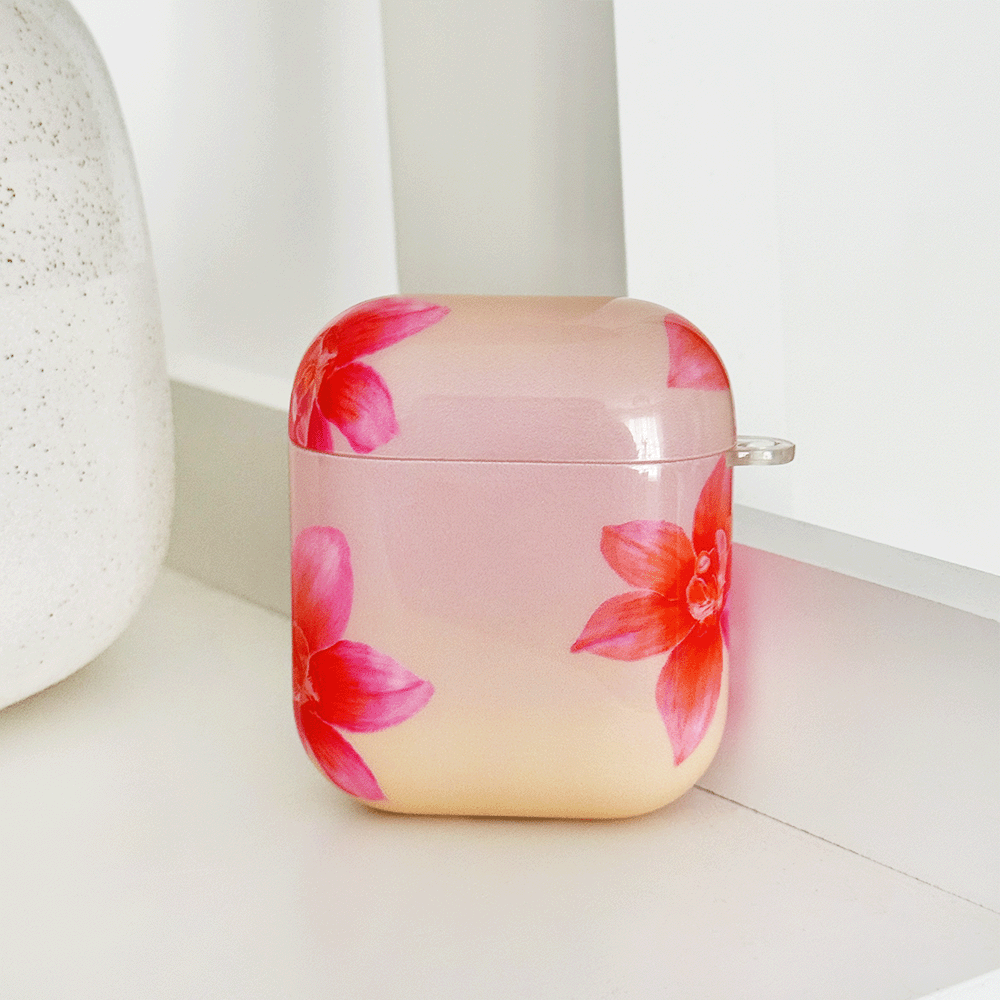 Pink AirPods Case with pink and orange orchid flower design.