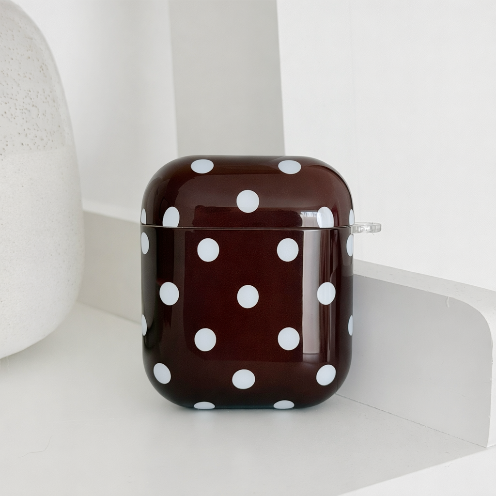Brown AirPods Case with blue polka dot design.