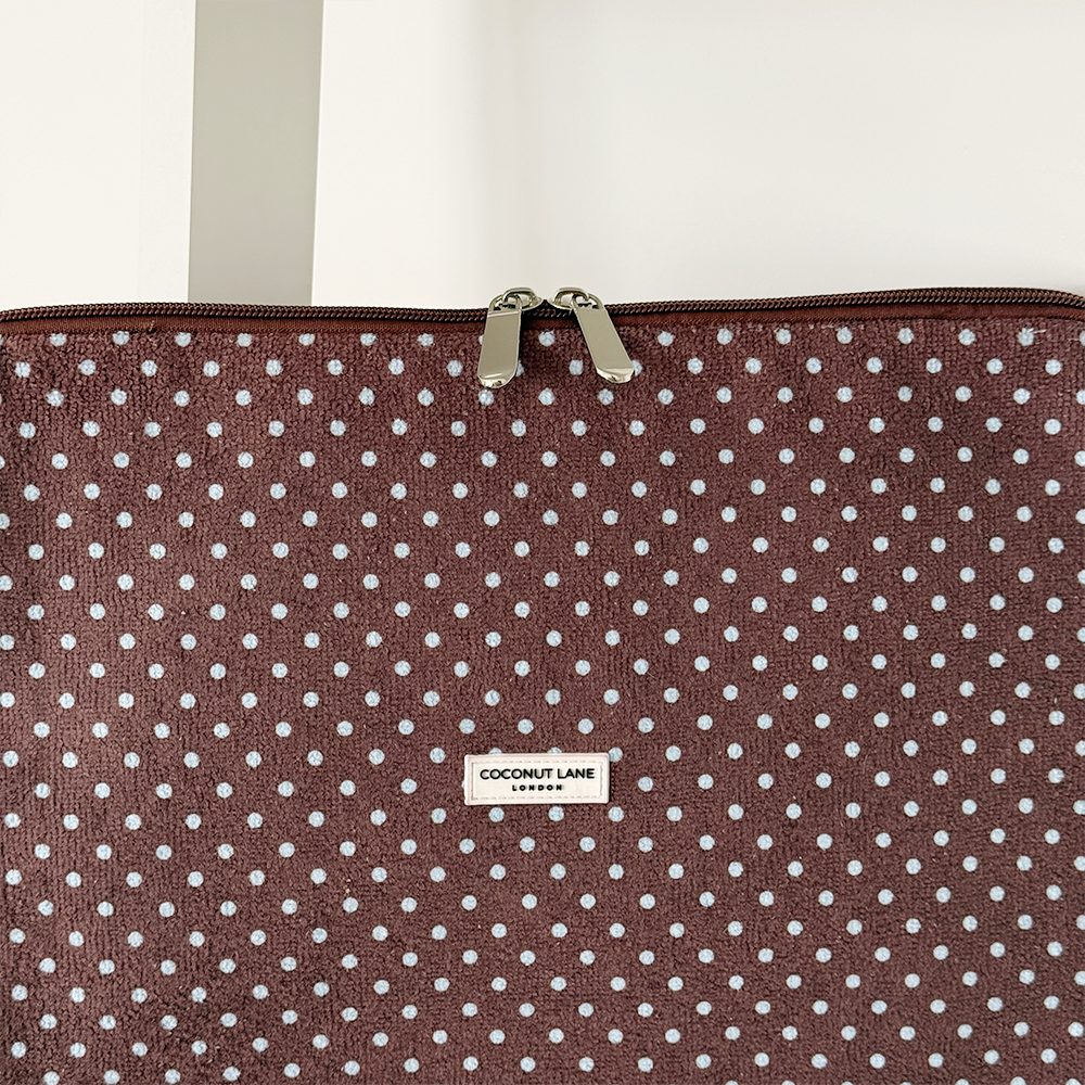Brown and blue polka dot design Laptop Sleeve with silver zip and Coconut Lane logo badge.