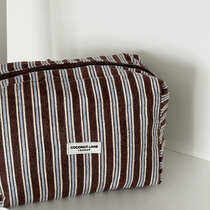Brown towel texture Makeup Bag with blue and white stripe design. 
