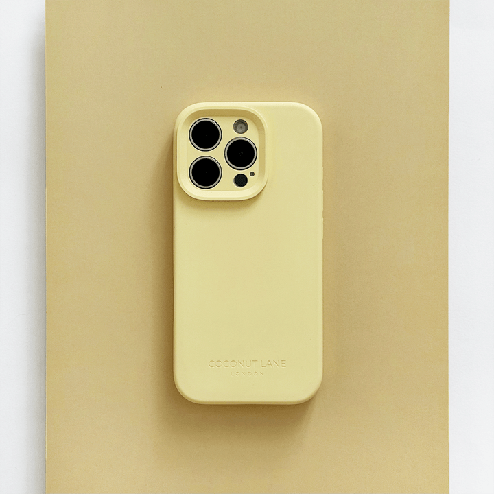 Yellow Phone Case with 'Coconut Lane' branding on a pink background.