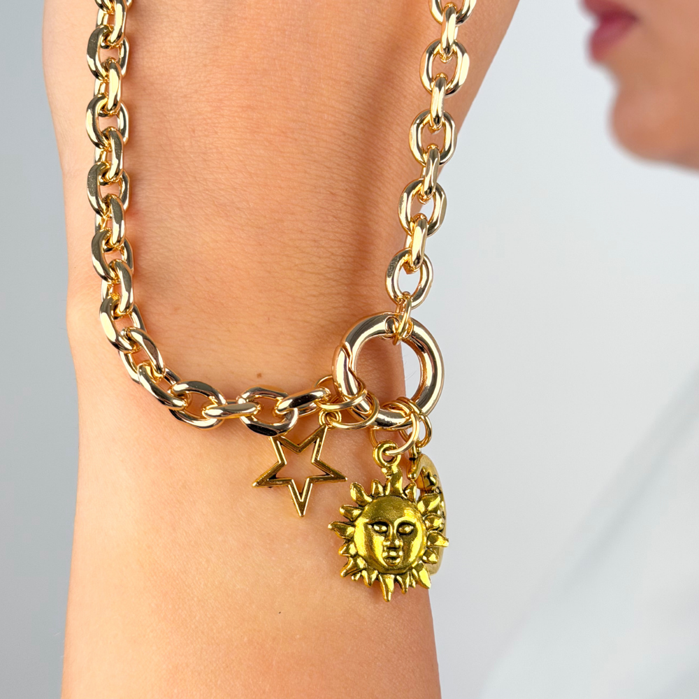 Star charm shown on gold phone strap lifestyle image
