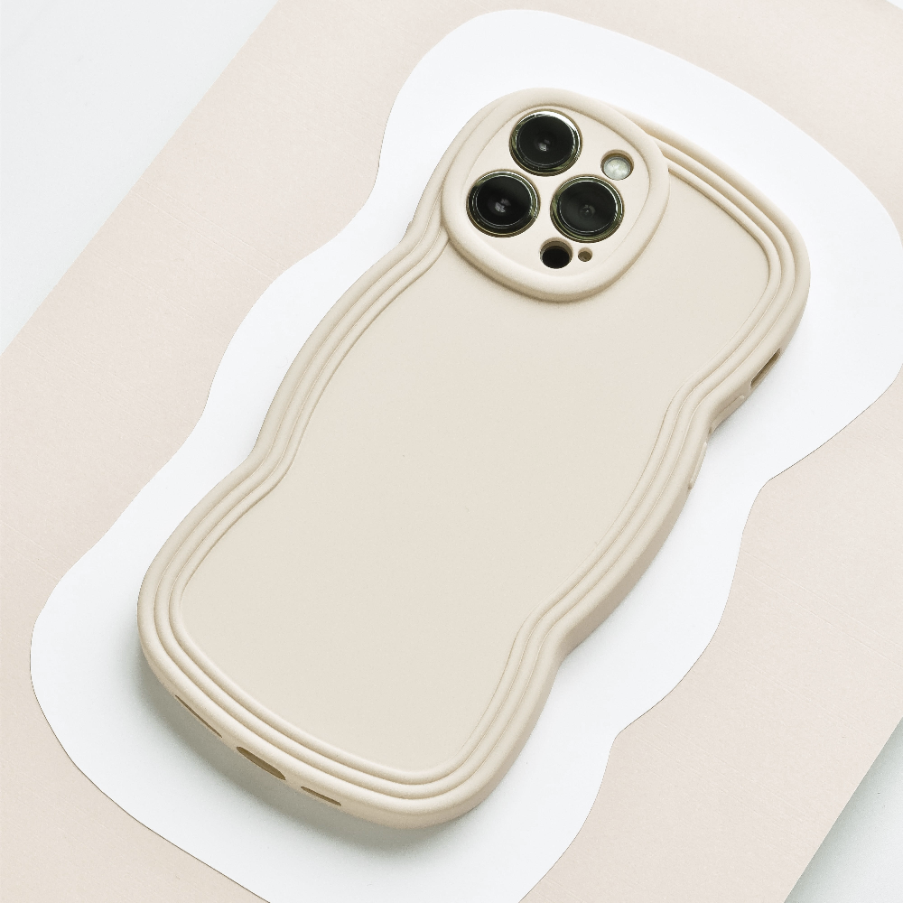 Flatlay style image of cream phone case with wavy edges.