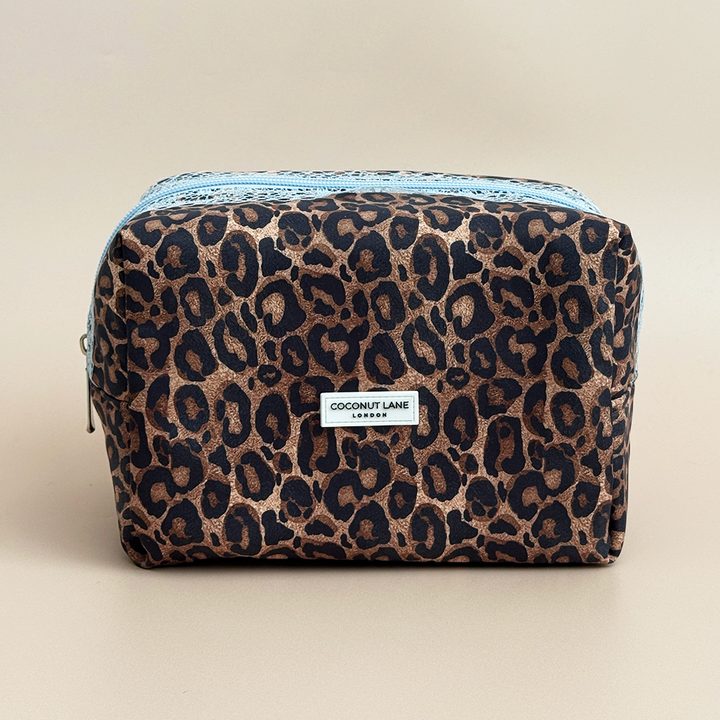 Coconut Lane Leopard Lace makeup bag featuring brown and black leopard print, pale blue lace trim and matching zip fastening.