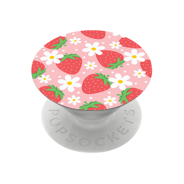 The PopSocket Grip - Berry Cute Strawberry by Coconut Lane is a delightful phone accessory featuring a round top adorned with red strawberries and white flowers with yellow centers on a pink background. The white collapsible grip and stand provide both style and a secure hold, with "PopSockets" embossed around the base.