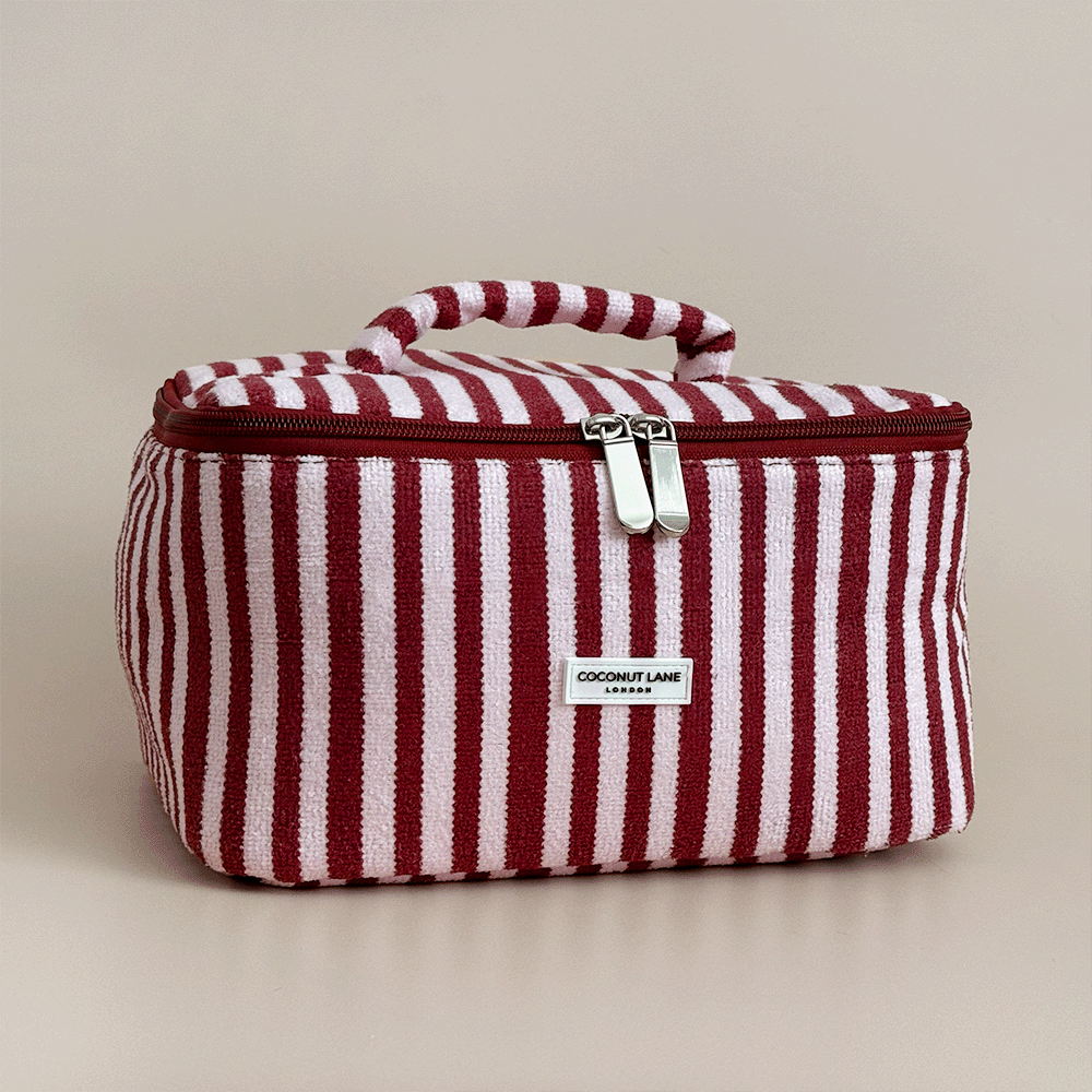 Burgundy and light pink striped Vanity Case, with handle, silver zip and Coconut Lane logo badge.