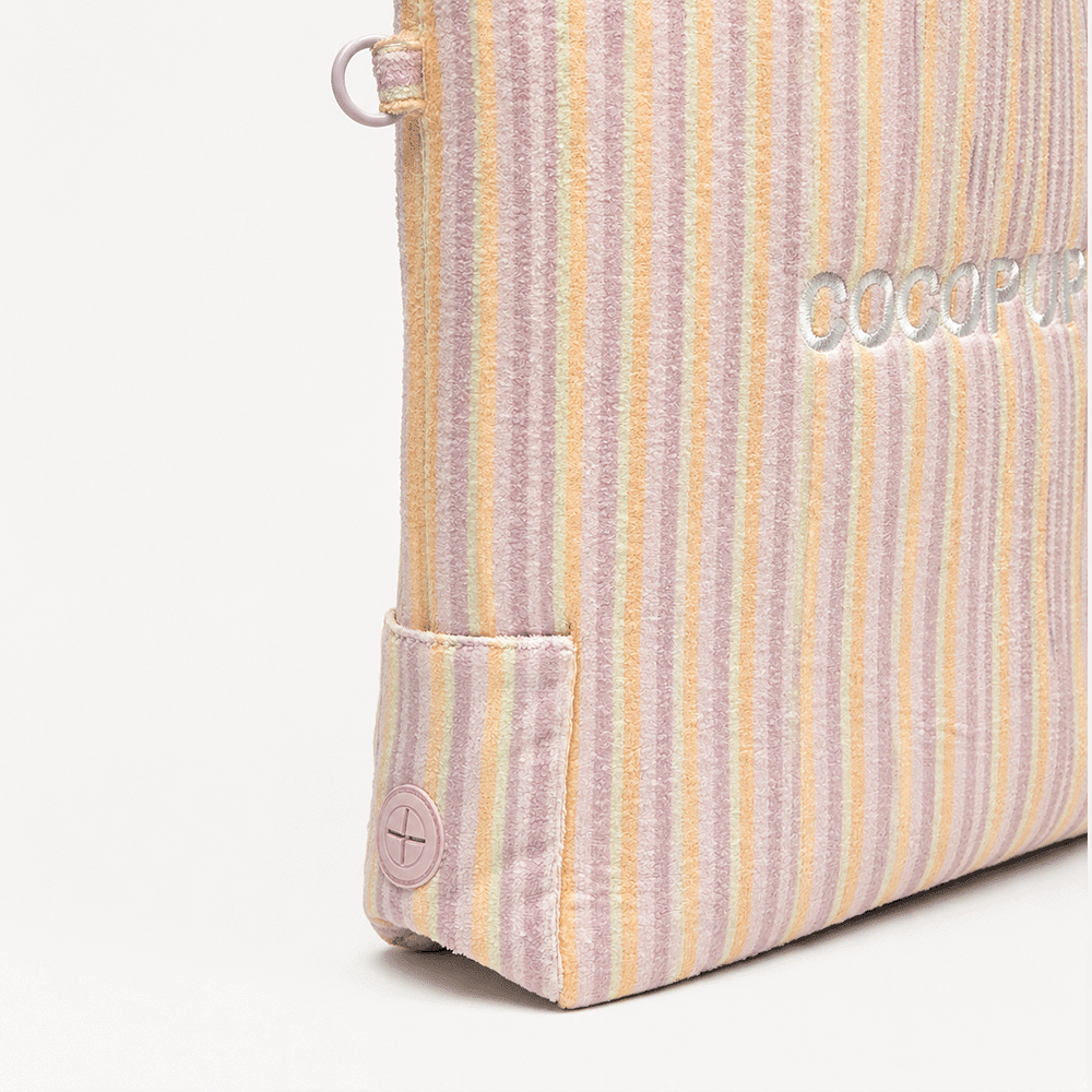 Pastel striped tote bag with an embroidered logo on the corner.