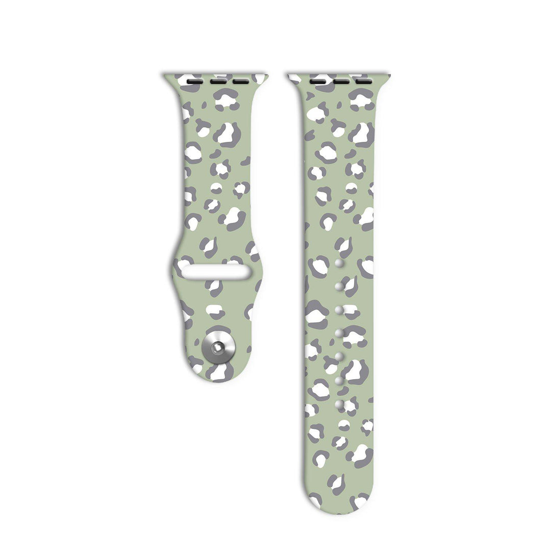 Two pieces of the Sage Leopard Apple Watch Strap by Coconut Lane are displayed against a white background. The strap features a light green base color with a gray and white leopard print pattern, reflecting its unique style from the Sage Leopard Collection.