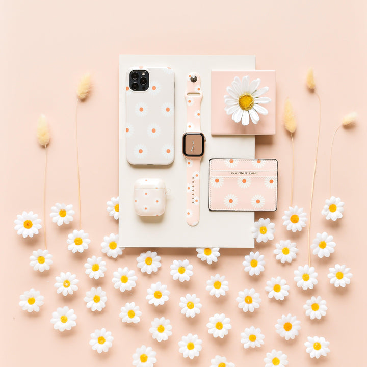daisies-on-beige-background-tech-accessories