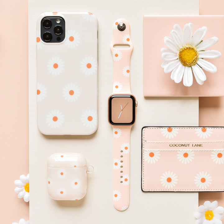 daisies-on-beige-background-tech-accessories