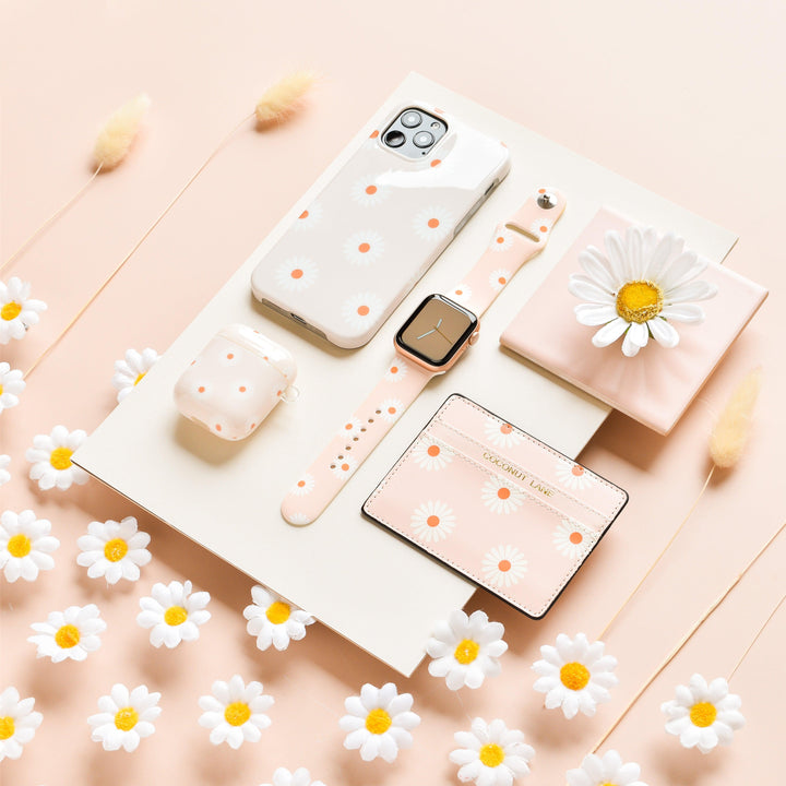 daisies-on-beige-background-tech-accessories