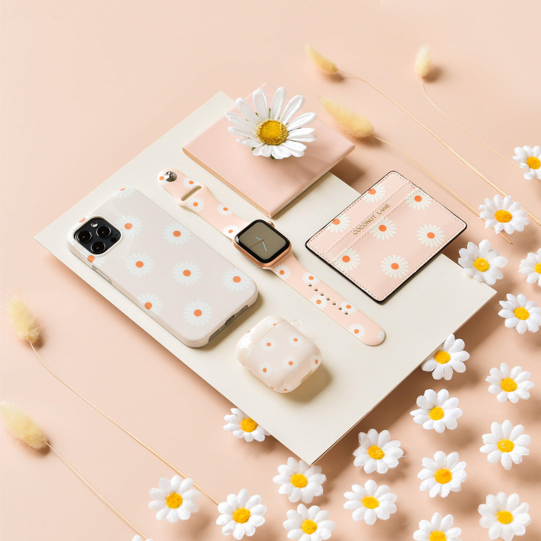 daisies-on-beige-background-tech-accessories